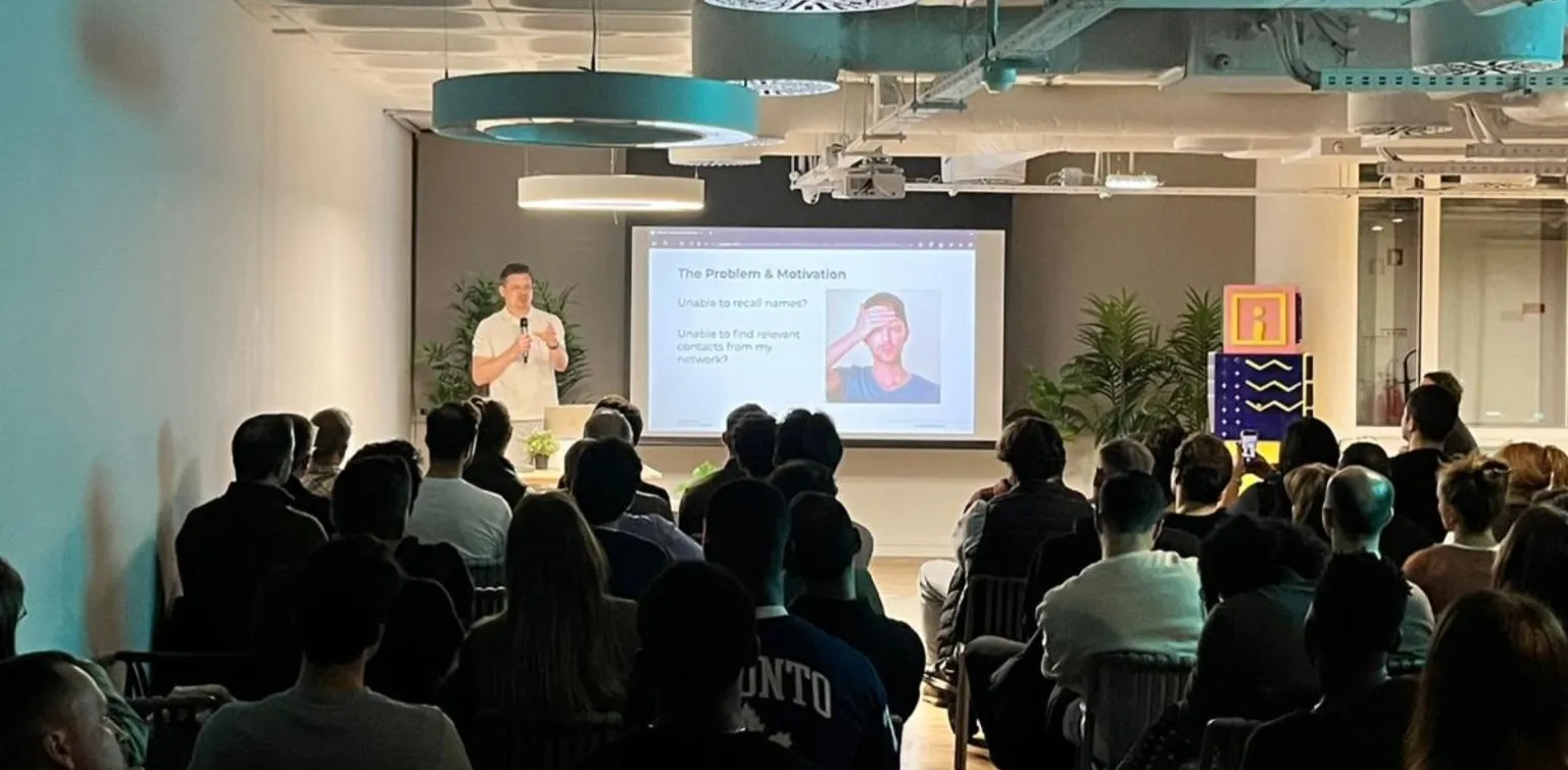 Stan Kosyakov speaking at an AI event